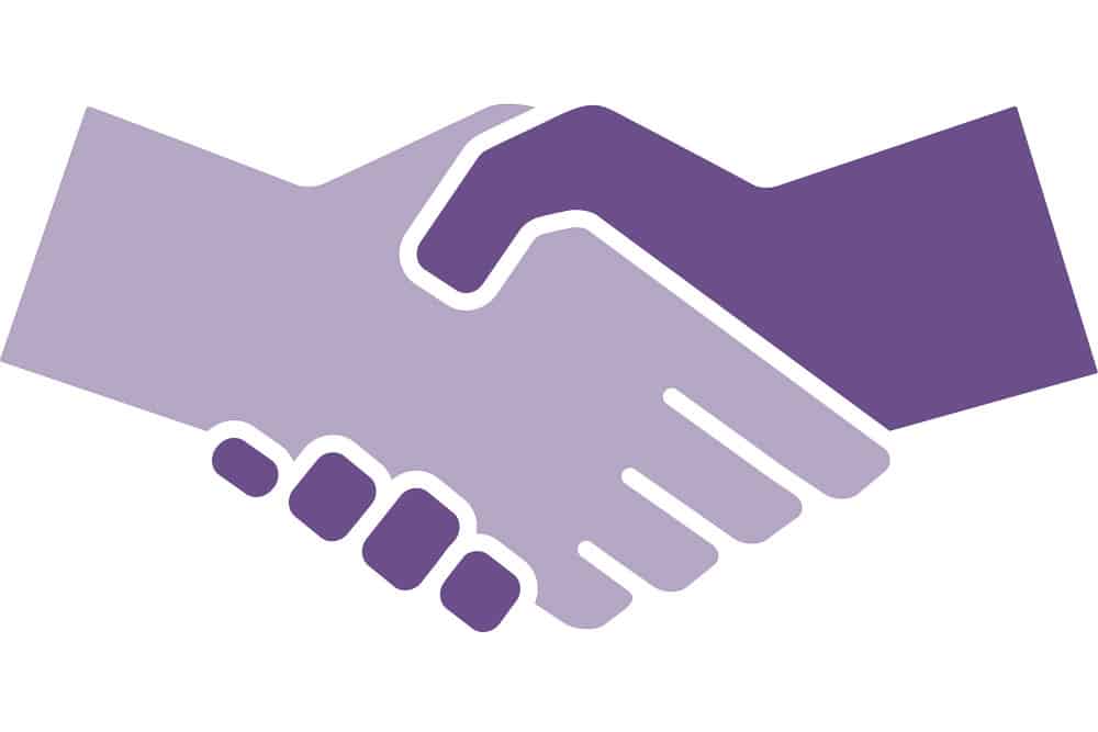 A purple and white handshake icon on a white background, representing the synergy between mobility and the parking industry.