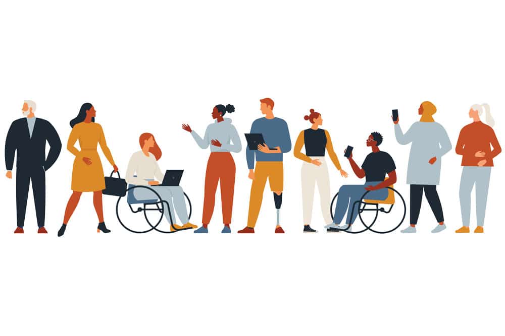 A group of people in wheelchairs are standing next to each other.