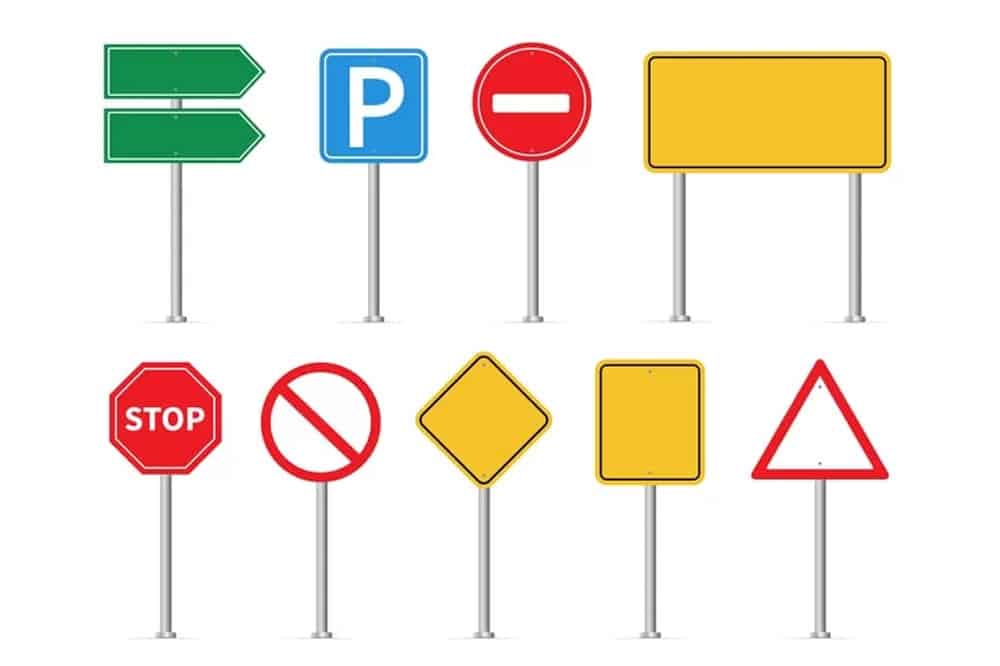 A set of various road signs on a white background, visible everywhere.