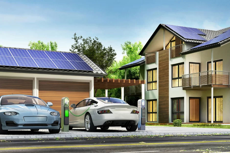 Electric cars parked in front of a residential garage while charging