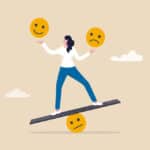 Illustration of woman balancing on a see-saw juggling happy and sad emojis
