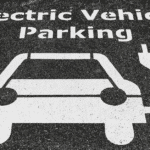 An electric vehicle parking sign indicating the presence of EV Charging Stations.
