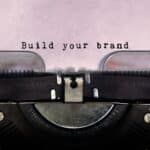 An old typewriter with the words build your personal brand.
