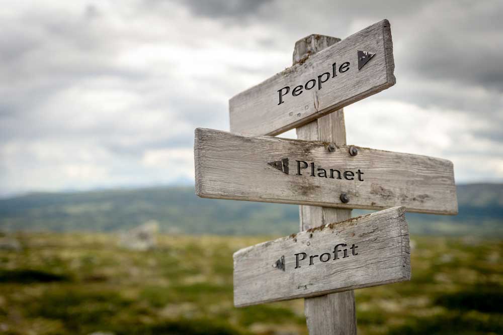 Signs that say People, Planet, Profit
