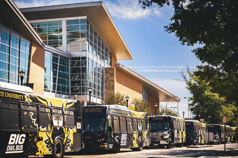 Busses Parked outside an event at a university