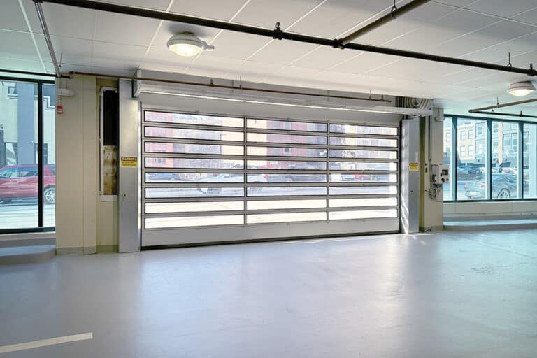 A futuristic glass garage door revolutionizing parking and mobility.