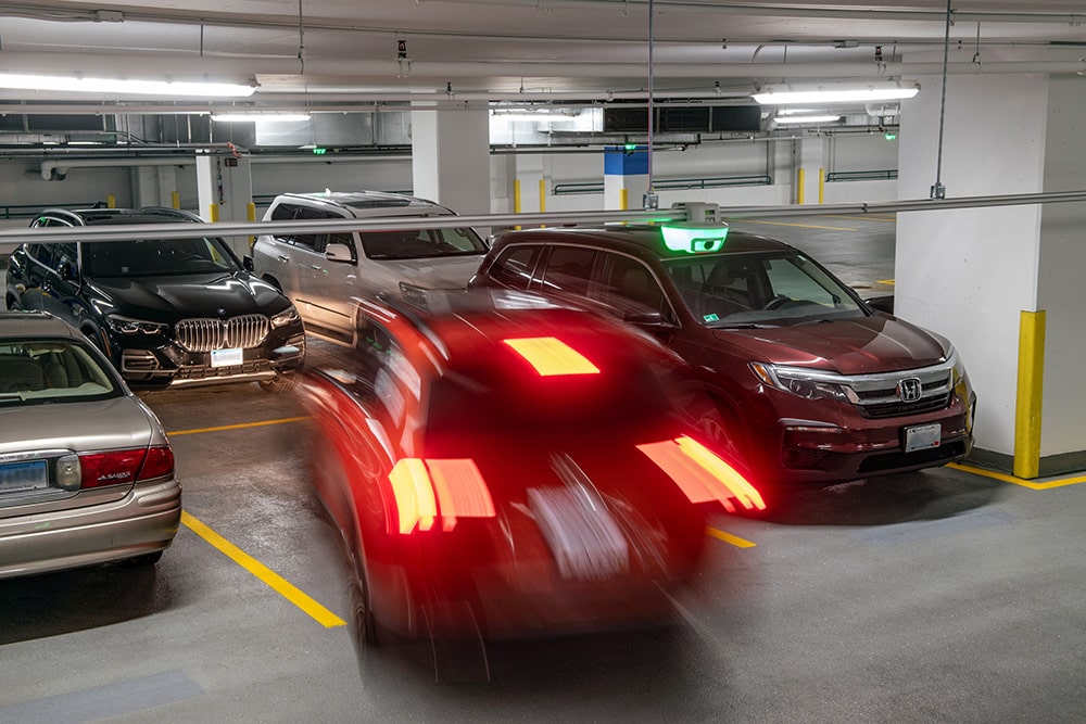 Smart City parking garage with parked cars.