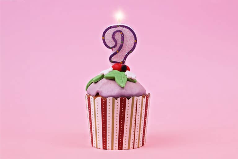 Pink cupcake with a question mark candle?