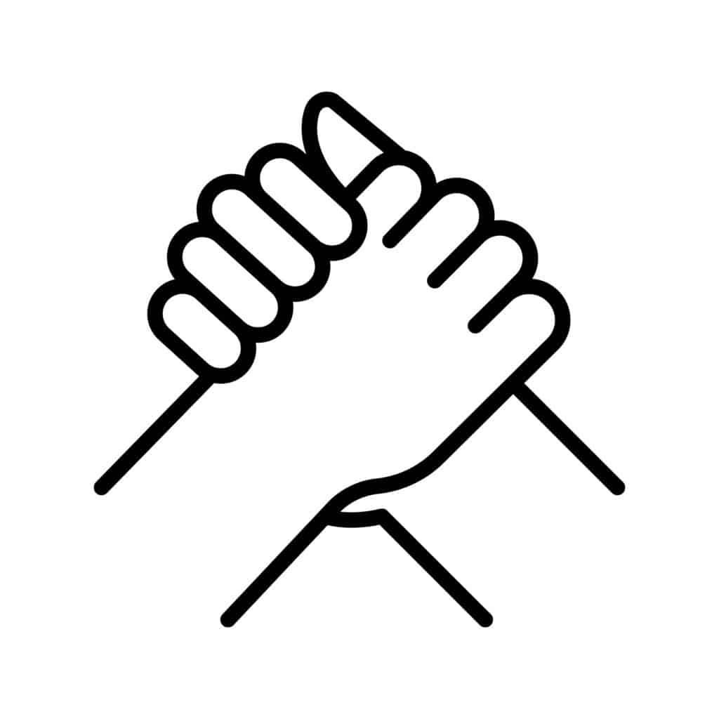A pair of hands from different parts of a community, town and gown, holding each other in a handshake representing strong relationships.