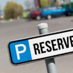 A parking sign that says "Reserved"