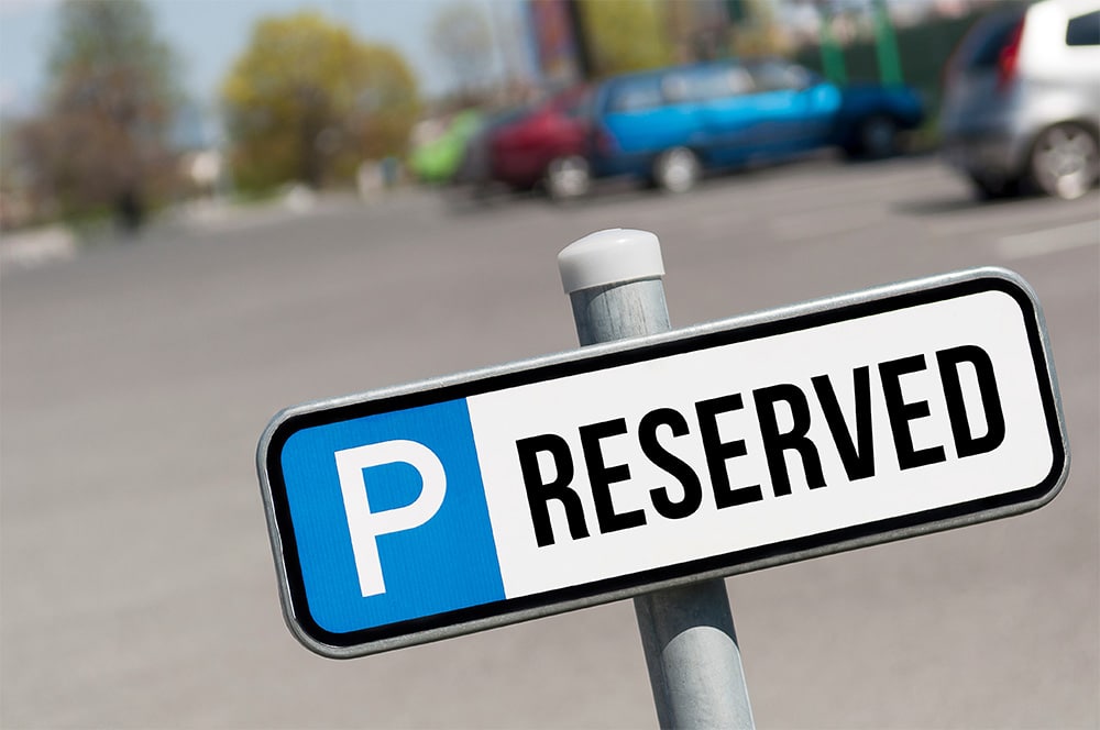 A parking sign that says "Reserved"
