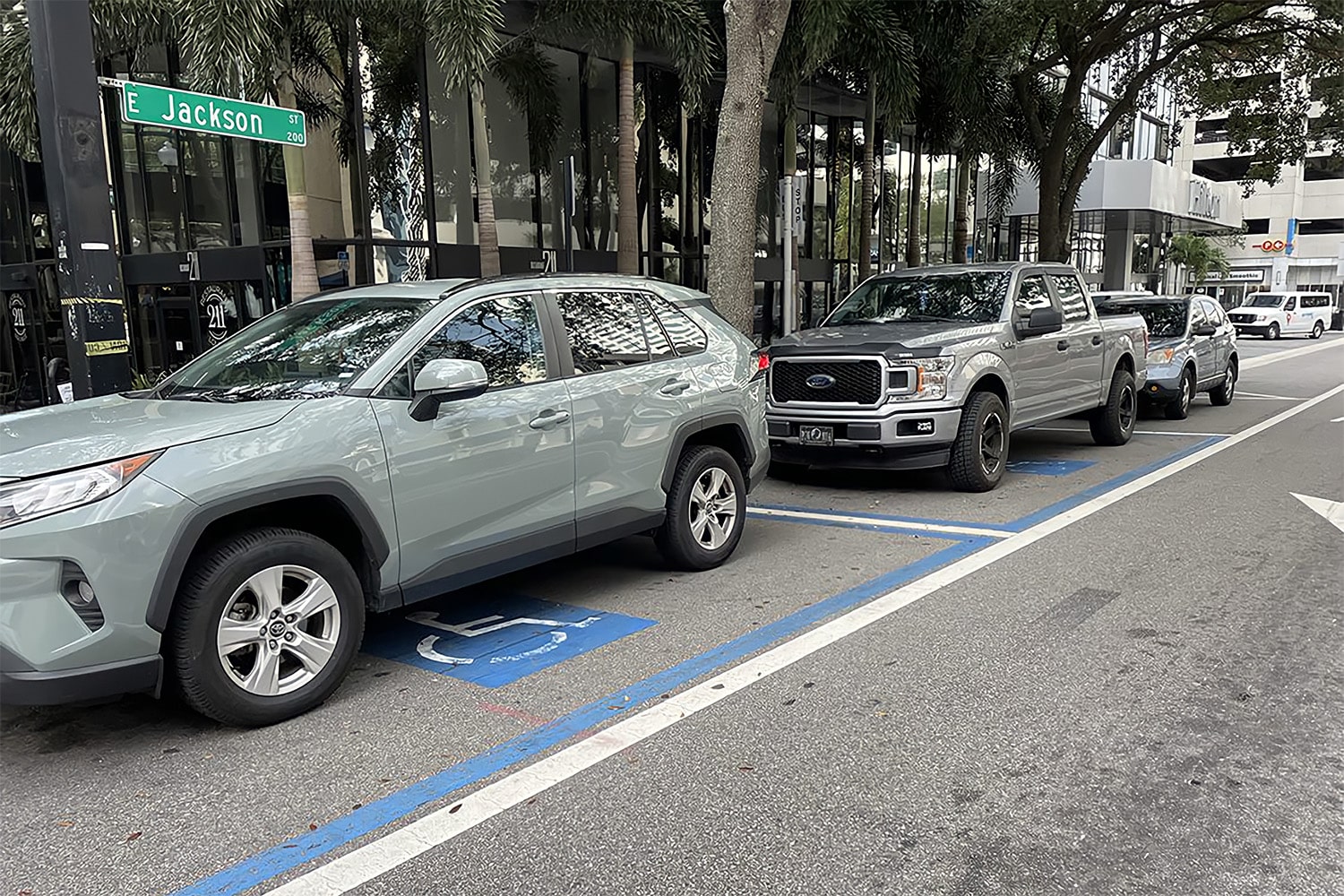 Photo of cars parked in accessible parking spaces on E. Jackson Street in Tampa Bay, FL