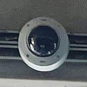 Close-up photo of a license plate, reading camera inside of security bubble