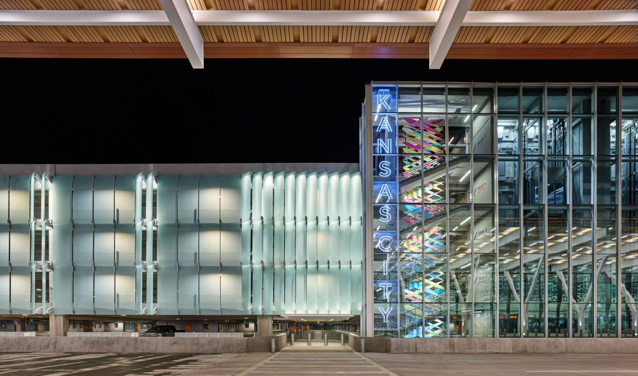 A building with a glass facade at night, showcasing Bendheim's innovative product.