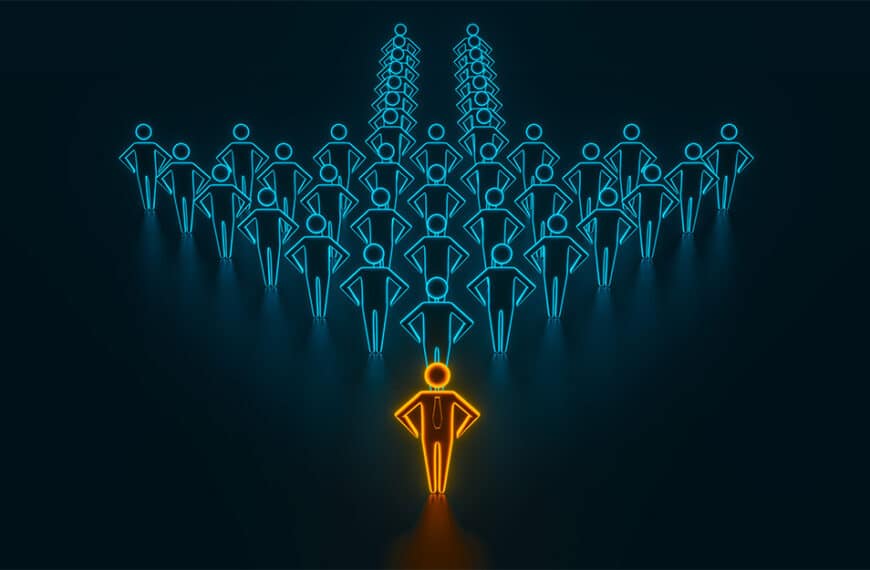 Illustration of a crowd of blue people icons forming the shape of an arrow with an orange person standing in front. Concept of leadership.